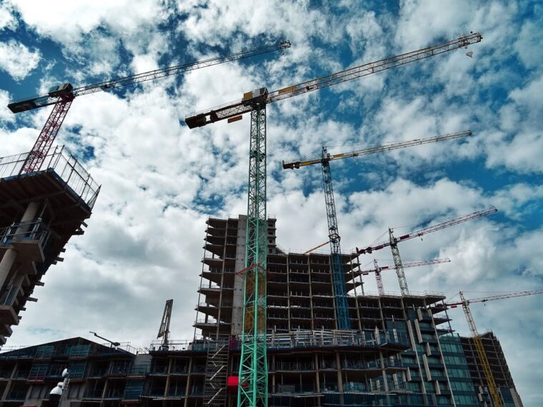 image of construction cranes